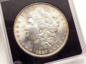 lot 61 image: 1887 P Morgan Silver Dollar - Highest Grade