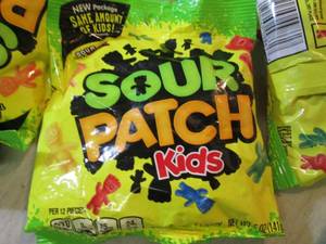 lot 127 image: 12 Bags of Sour Patch Kids Candy Da...