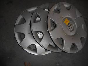 lot 28 image: Three 16 Volkswagen Hubcaps
