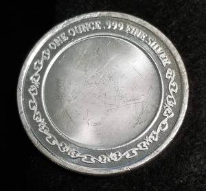 lot 54 image: 1 TROY OZ. .999 FINE SILVER EAGLE ON SHIELD DESIGN
