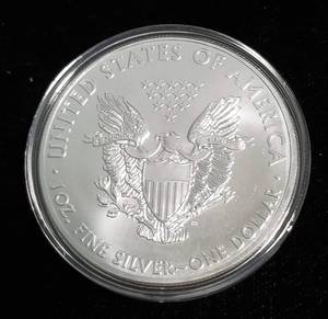 lot 59 image: 2012 AMERICAN SILVER EAGLE 1 TROY OZ. .999 FINE SILVER IN AIRTITE