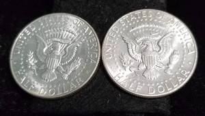 lot 63 image: 2 AU-UNC 1964 KENNEDY SILVER HALF DOLLARS