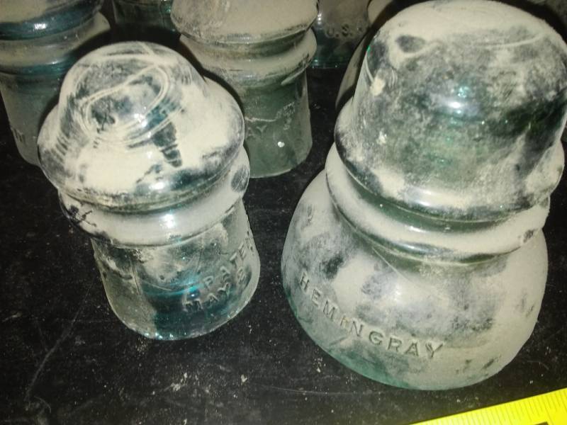 lot 5 image: 12 green glass insulators