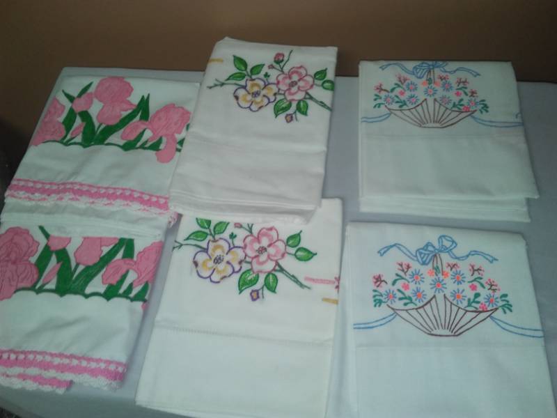 lot 27 image: Three sets of pillowcases - new  embroidery.