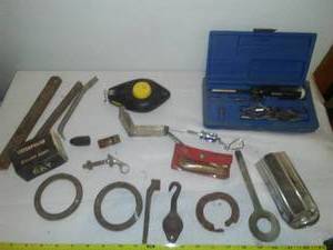 lot 104 image: Misc. tools  hardware. Caterpillar Starter button, chalkline.