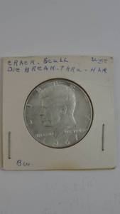lot 28 image: 1967 Kennedy Half Dollar Crack Scull