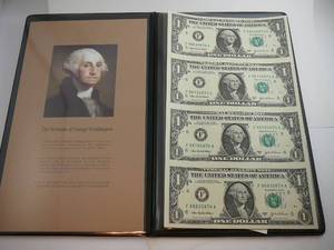lot 115 image: 2003A World Reserve Uncut Sheet Of 4 $1 Star Notes In Folder