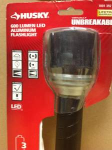 lot 35 image: Husky 600 Lumens Virtually Unbreakable Alumum Flashlight in good condition