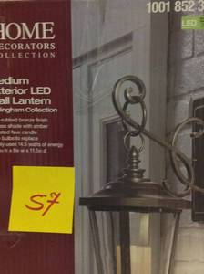 lot 57 image: Bellingham Oil-Rubbed Bronze LED Outdoor Wall Lantern Sconce with Clear Glass and Amber Glass Candle not used
