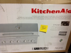 lot 312 image: Kitchen Aid 4-Burner Built-in Propane Gas Island Grill Head in Stainless Steel with Searing Main Burner and Rotisserie Burner not used Retails for $999