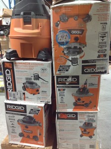 Pallet of assorted Ridgid Vacuums different sizes some may need repair or have missing pieces