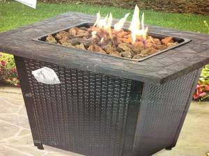 lot 9 image: Endless Summer 30 in. W Bronze Finish Steel Base Faux Slate Mantel LP Gas Fire Pit with Electronic Igition and Lava Rocks in good condition