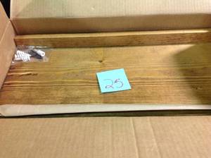 lot 25 image: 24 in. W x 8 in. D x 1.5 in. H Light Brown Driftwood Wall Mounted Shelf with Black Brackets not used