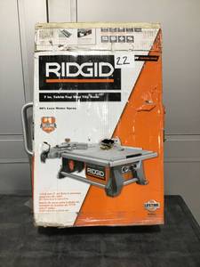 lot 22 image: RIDGID 6.5 Amp Corded 7 in. Table Top Wet Tile Saw- Used, works. Needs blade.