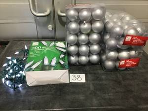 lot 38 image: HOLIDAYChristmas Lot-Lot of Silver Round Ornaments (3 boxes) and LED Lights (1 strand, 66 ft)- As is, lights work.