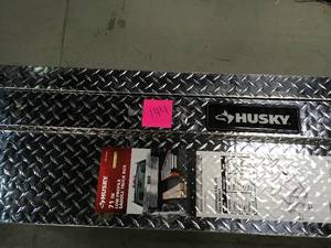 lot 144 image: Husky 71.36 Diamond Plate Aluminum Full Size Crossbed Truck Tool Box DOOR DOESNT OPEN needs repair