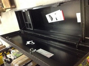 lot 212 image: Husky 71.36 Matte Black Aluminum Full Size Crossbed Truck Tool Box