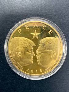 lot 22 image: Peace Through Strength Trump Kim Jong Un Coin