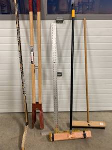lot 76 image: Post Hole Digger, Drywall Square, 2 Brooms, Hockey Stick