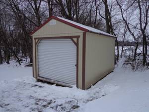 12 x 16 Shed. Less than 1 year old, good overall condition.  11 tall shed.  Roll up door.  Service door has a window.