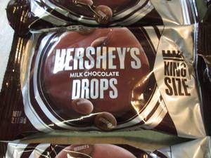 lot 204 image: 12 King Size Bags of Hersheys Milk ...