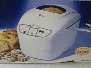 lot 76 image: Oster 58-Minute Express Bake Bread ...