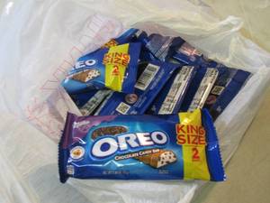 lot 239 image: 12 Oreo Candy Bars Best by Mar 2020...