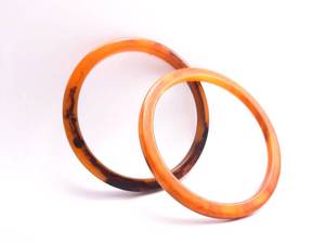 lot 60 image: (2) Vintage bakelite bangles, pair of bracelets, 1940s.