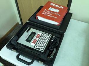 lot 105 image: Bosch Radionics Alarm Security Programmer D5200, Programming System Information Binder with Hard Carry Case