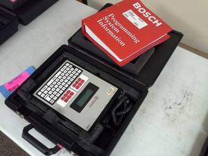 lot 106 image: Bosch Radionics Alarm Security Programmer D5200, Programming System Information Binder with Hard Carry Case