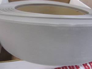 lot 21 image: Ropper Cop. Roppe 4 In X .080 In X 120 Ft Pewter Vinyl Wall Cove Base Coil C40C53P178