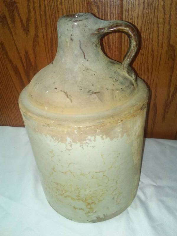 lot 28 image: 2 - 1 gallon Crock Jugs out of the barn.