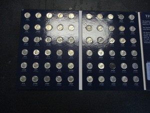 lot 8 image: 1965-2009 lot of (90) Roosevelt Dimes in a nice Warmans Hardcover Folder