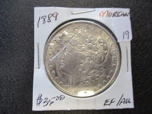 lot 19 image: 1889 EFAU Morgan Silver Dollar