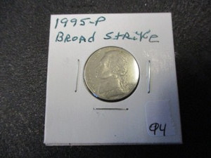 lot 94 image: Rare Error 1995 Jefferson Nickel- Broad Strike