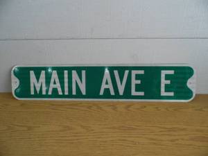 lot 115 image: Main Ave E. Metal Street Sign