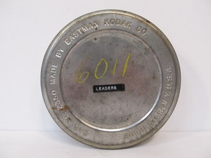 lot 307 image: Vintage Film Canister w Official Pirates of The Caribbean Movie Trailer
