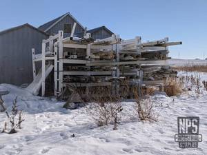 lot 21 image: Large Rack and Dimensional PVC Inventory on WEST End of Building