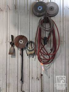 lot 24 image: Saw Blades, Air Hose and More on Wall