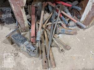 lot 79 image: Contents Under Bench - Tire Irons, Hitches, Pry Bars and More