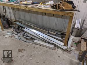 lot 136 image: Aluminum and Steel Pieces Under Bench