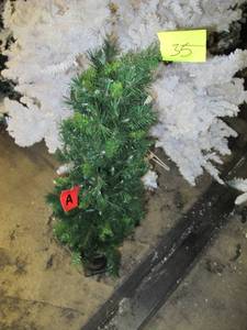 Artificial Slim Profile LED Tree in green with decorative pot, roughly 4 feet tall by Vickerman