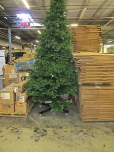 Artificial LED Tree in green, roughly 15 feet tall by Vickerman - On Wheeled Base