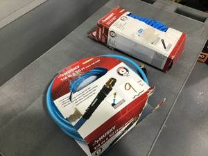 lot 9 image: HUSKY Lot of 2 Air Hoses One 14 inch x 50 feet hose and one 14 inch x 25 feet coil hose