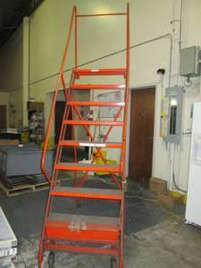 lot 33 image: Metal warehouse step ladder on whee...