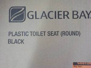 lot 232 image: Glacier Bay Plastic Round Black Toi...