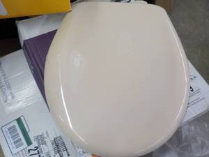 lot 234 image: Statite Bisque Toilet Seat...