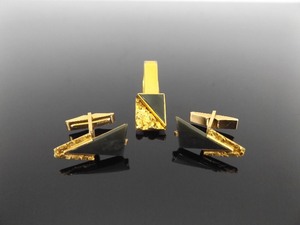 lot 55 image: 10k Yellow Gold and Black Onyx Cufflink and Tie Clip Set