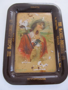 lot 20 image: Orig Antique tin Litho Advertising Tip Tray - Lady Golfer - McCaull Dinsmore Grain Company 