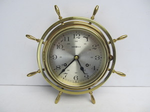 lot 44 image: Vintage West German HOWARD MILLER Brass Ships Wheel Clock